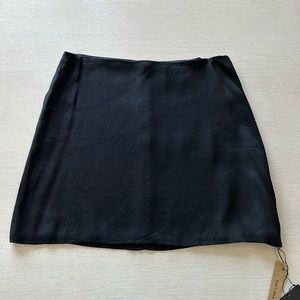Reformation black mini skirt. Never worn.